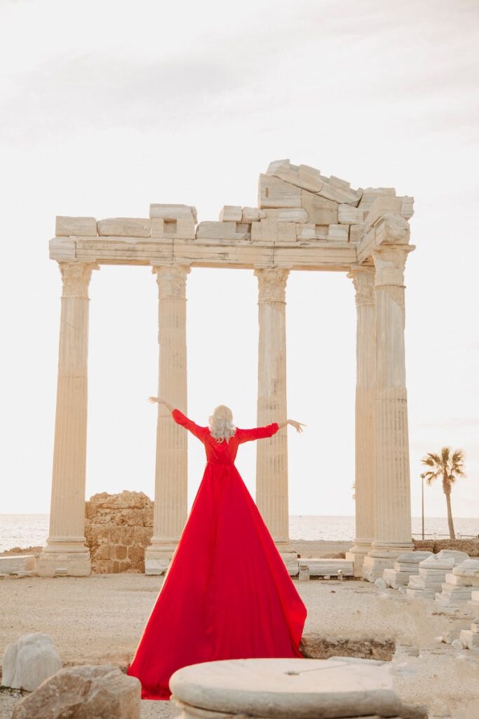 Woman Wearing Red Dress in a Temple Ruin